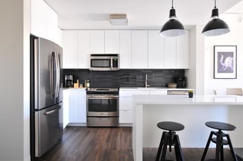 modern kitchen with black backsplash in nnn property